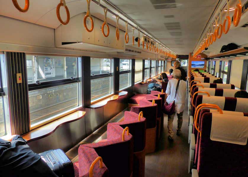 The interior of the Sky Castle train with viewing seats on the east side of the carriage.
