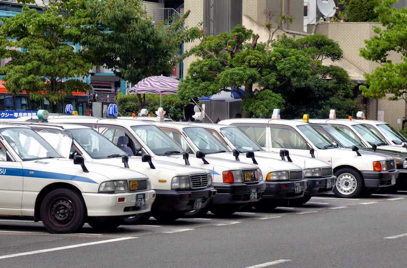 Taxis lined up at Matsuyamashi train and tram station.