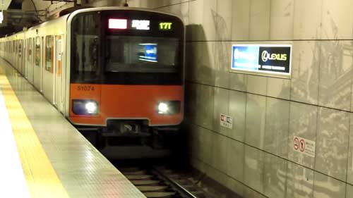 Train arriving at Motomachi-Chukagai Station, Yokohama, Japan.